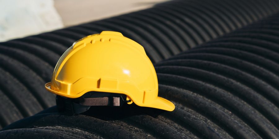 Yellow safety helmet representing HSE management and project safety
